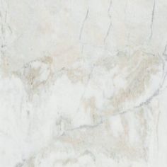 a white marble textured surface with some brown and tan colors