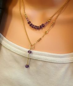 Natural gemstone purple amethyst layered Y necklace with real 14k gold-plated brass rolo chain. Set of 2 pieces. Chain: real 14k gold-plated brass is 2mmx 2mm (small chain) with hand wire natural gemstone purple amethyst (4-6mm) connector and 18k gold plated spacers. Each necklace measures: 15-17 inches (includes 2" extension chain). Drop down 1.25" Material: -natural gemstone, real 14k & 18k gold-plated brass -------------------- SHIPPING ◊ Get your orders FAST! Our processing time is only 1-2 business days for most orders.  ------------------- JEWELRY PACKAGING ◊ This item comes packaged in our high quality metal jewelry box with red velvety cover and white satin lining inside lid - ready to gift! -------------------------- CUSTOMER SERVICE: * We pride ourselves on our quick response tim Gold Amethyst Jewelry With Adjustable Chain, Dainty Amethyst Jewelry With Adjustable Chain, Gold Gemstone Necklaces For Layering, Gold Amethyst Necklace With Adjustable Chain, Gold Gemstone Crystal Necklace For Layering, Adjustable 14k Gold-filled Gemstone Necklace, Gold Amethyst Jewelry With Delicate Chain, Adjustable 14k Gold Filled Gemstone Necklace, Purple Double Strand Jewelry For Gifts