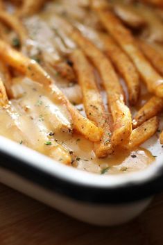 french fries covered in gravy on a plate