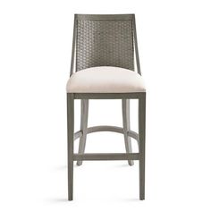 an upholstered bar stool with a white cushion on the back and seat pad