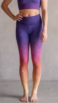 Model wearing WERKSHOP Rainbow Mosaic Athlesiure Leggings and matching top. The leggings are printed with what look like tiny mosaic tiles in an ombre effect from purple at the waistband, to pink at the knee ... then coral and a soft warm yellow at the leg opening. Multicolor Athleisure Yoga Pants For Summer, Multicolor High Waist Leggings For Yoga, Multicolor Full Length Sports Leggings, Multicolor Moisture-wicking Fitted Leggings, Rainbow Mosaic, Triathlon Gear, Casual Multicolor Moisture-wicking Leggings, Gym Tights, Multicolor Full-length Athleisure Leggings