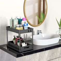 a bathroom counter with a sink, mirror and soap dispenser