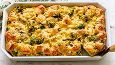 a casserole dish with broccoli and cheese