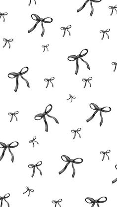 black and white bows on a white background seamless wallpaper or fabric design for clothing, home decor