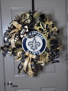 a new orleans saints wreath on a door