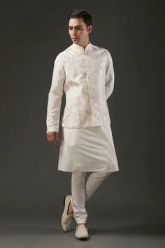 Ivory chanderi silk Nehru jacket with resham embroidery in bird and floral motifs.
Component: 1
Pattern: Embroidered
Type Of Work: Bird,Floral
Neckline: Band
Sleeve Type: Sleeveless
Fabric: Chanderi Silk, Lining: Silk 
Color: Ivory
Other Details: 
Resham work
Note: Pant and kurta worn by the model is not for sale
Occasion: Groom,Wedding - Aza Fashions Nehru Jacket For Men, Resham Embroidery, Resham Work, Mens Kurta Designs, Rohit Bal, Embroidered Bird, Nehru Jacket, Nehru Jackets, Jacket For Men