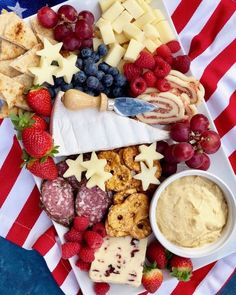 an american flag platter with cheese, crackers, fruit, and other snacks