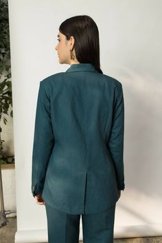 Description: This impeccably tailored blazer is subtly shaped on the waist with front & back darts. It has a longer collar than usual and shoulder pads for a structured look. It is finished with buttoned cuffs, flap pockets and a single vent at the back. Wear it with the Boot-leg Pants for the perfect pant suit.Product Details: Slim fit Notch lapel Button closure Shoulder pads Completely lined Front welt pockets Fabric: Hemp Cotton 55% hemp & 45% cotton 100% cotton lining Made in India Size & Fi Crop Top Lehenga, Wrap Top Blouse, Womens Wrap Dress, Man Blazer, Men's Ethnic Wear, Men Trousers, Green Blazer, Perfect Pant, Pant Suit