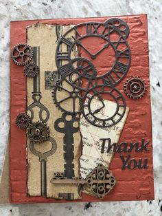 a thank card with an assortment of gears and keys on it, the words thank you are