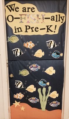 a door decorated with an ocean theme and words that read, we are all in pre - k