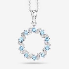 "Swiss Blue Topaz Pendant, Wreath Design Natural Swiss Blue Topaz Silver Pendant Necklace for Women, December Birthstone Pendant Necklace Product Details:  .925 Sterling Silver Stone Details: Swiss Blue Topaz Item Type: Pendant Subcategory: Blue Topaz Gross Wt: 5.35 Gemstone Wt: 1.30 ctw Total Stone Wt: 1.30 ctw Finish: Rhodium Plated Product Style: Circle Pendant Chain Type: Cable Chain Clasp: Spring Ring Clasps Total Qty Of Stones: 30 Height: 4.57 MM Width: 22.35 MM Length: 33.53 MM Primary St Round Light Blue Topaz Necklace, Light Blue Round Blue Topaz Necklace, Light Blue Round Cubic Zirconia Jewelry, Light Blue Round Birthstone Necklace, Light Blue Cubic Zirconia Jewelry, Light Blue Birthstone Necklace, Light Blue Jewelry With Diamond Accents, Fine Jewelry In Light Blue Color, Fine Jewelry In Light Blue