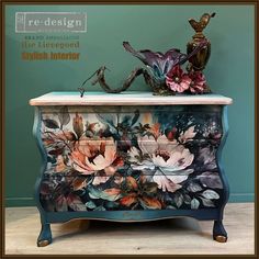 an ornate painted dresser with flowers on it