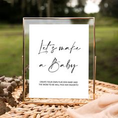 a baby shower sign sitting on top of a table