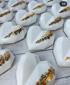 some white plates with gold designs on them