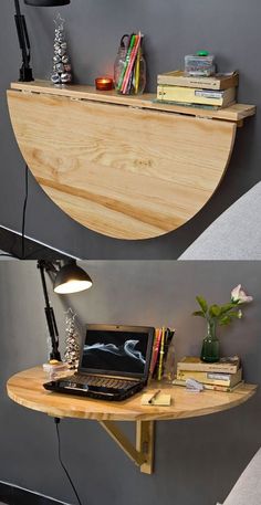 a desk with a laptop computer on top of it and a lamp next to it