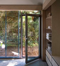 an open room with sliding glass doors leading to the outside