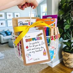 a person holding a basket filled with lots of cards and paper tags that say i'm no supplies