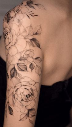 a woman's arm with flowers on it