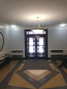 a person sitting on a bench in front of a door