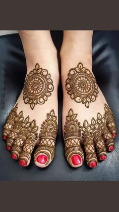 the feet are decorated with henna designs