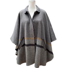 Madewell Hi-Line Gray Colorblock Poncho Cape. Size - M/L. Gently Worn. No Flaws. Oversized By Design. Hidden 5-Button Closure. Open Sides. Flap Pockets. Faux Leather Trim On Pockets And Collar. Length Is Approximately 32” From Shoulders To Longest Hem. Laying Flat, Measures Approximately 43” Across Bottom (By Black Stripe). 70% Wool, 30% Polyester. Dry Clean. Ships Fast With Care. Non-Smoking, Pet-Free. Top Rated Seller Since 2017. Oversized Gray Cape For Fall, Gray Oversized Cape Outerwear, Oversized Gray Cape Outerwear, Gray Cape For Fall Season, Gray Poncho For Cold Weather In Fall, Madewell Jacket, Poncho Cape, Leather Trim, Top Rated