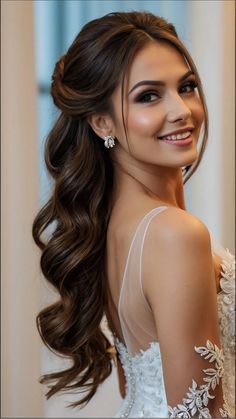 a woman with long hair wearing a wedding dress