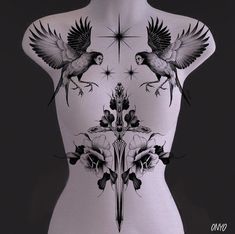 the back of a mannequin with tattoos on it's body and two birds