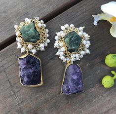 Amethyst & Green Onyx Druzy earrings - A rare pair of earrings -designer druzy raw gemstone earrings -Gemstone is Purple Amethyst and green onyx in its raw form bezel set in Gold plated brass. -post earrings -All gemstones are natural and have been mined from the Earth. Get this beautiful pair in a Gift box or Gift Bag Thank you for your appreciateion and love for my work Go back to Storefront: http://Taneesijewelry.etsy.com Go back to see more earrings https://www.etsy.com/shop/taneesijewel Handmade Fusion Bridal Earrings As Gift, Fusion Natural Stone Jewelry For Weddings, Fusion Natural Stones Wedding Jewelry, Fusion Wedding Jewelry With Natural Stones, Fusion Style Natural Stones Wedding Jewelry, Fusion Style Gemstone Accented Earrings For Gifts, Fusion Style Gemstone Accent Earrings For Gifts, Fusion Style Earrings With Gemstone Accents For Gifts, Fusion Style Gemstone Earrings As Gift