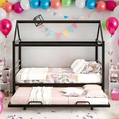 a bedroom with balloons and bed in it