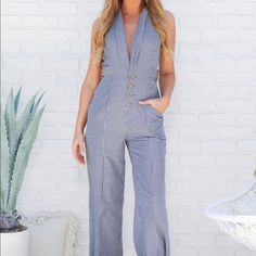 New. Never Worn Color: Navy/Denim Blue, Ivory Collared V-Neck Faux Side Belt Details Functional Front Buttons Functional Pockets Lined - Opaque 48" Armpit To Hemline 28" Inseam Fitted Casual Denim Jumpsuit With V-neck, Chic V-neck Jumpsuits And Rompers With Button Closure, Trendy V-neck Denim Jumpsuit For Spring, Spring V-neck Denim Jumpsuit With Pockets, Spring Cotton V-neck Denim Jumpsuit, Chic Blue V-neck Denim Jumpsuit, Cotton Denim V-neck Jumpsuit, Denim Blue V-neck Jumpsuit For Summer, Summer Denim Blue V-neck Jumpsuit