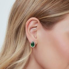 Indulge in timeless elegance with our "Forest green" stud earrings.  Crafted with exquisite attention to detail, each earring features a captivating pear-cut Emerald, its deep Green hue reminiscent of vast ancient forests depths.  Encircled by a sparkling halo of brilliant diamonds, these earrings exude luxury and sophistication.  Set in lustrous 14K gold, they effortlessly elevate any ensemble, whether it's a formal affair or a chic everyday look. With their delicate yet striking design, the "F Green Stud Earrings, Deep Emerald Green, Halo Stud Earrings, Halo Earrings Studs, Green Earrings, Diamond Halo, Emerald Diamond, Brilliant Diamond, Jewelry Earrings Hoops