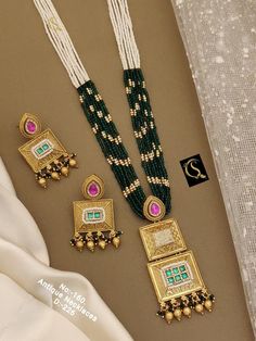 Description :- Necklace /Indian Necklace Set/ Indian Choker Necklace/ Pearl Necklace /Guttapusalu necklace /Temple jewelry/ South Indian jewelry Gift yourself a royal look with this perfectly crafted kundan necklace set from Manalisstudio. Crafted with high quality kundan stones and pearls, it is impressive in design. The green enamel artwork adds perfect texture to the design. Perfect for weddings and festivities, this antique necklace set should be put on with your favorite sari or lehenga. 10 Luxury Hallmarked Temple Necklace For Festivities, Handmade Kundan Necklaces For Formal Events, Handmade Kundan Necklaces For Formal Occasions, Fusion Style Necklace With 17 Jewels For Festivals, Elegant Multicolor Necklaces For Ceremonial Occasions, Elegant Long Meenakari Necklaces, Elegant Long Meenakari Necklace, Hand Set Fusion Style Necklaces For Celebration, Hand-set Pearl Necklace For Diwali Celebration