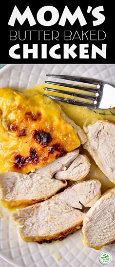 a white plate topped with sliced meat and cheese next to a fork on a table