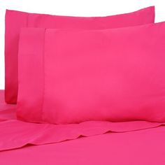 bright pink sheets and pillow cases on a bed