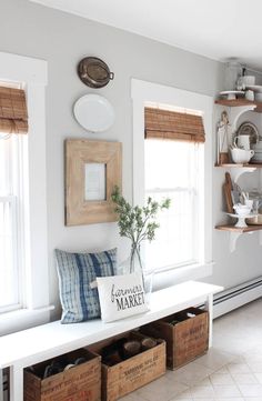 a white bench sitting in the middle of a kitchen