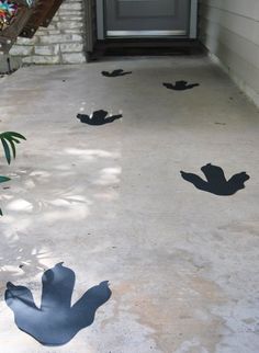 shadows cast on the concrete in front of a door