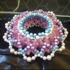 several bracelets with pearls and glass beads