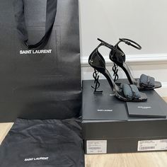 Authentic Opyum 110 Ysl Heel Black Size 37 Worn A Few Times Comes With Saint Laurent Shoe Box, Shopping Bag, Dust Bag, Care Instructions And Card Envelope. Purchased From Saint Laurent Store At South Coast Plaza- Costa Mesa, Ca. Saint Laurent Store, Ysl Heels, Saint Laurent Shoes, Shoe Box, Black Heels, Women's Shoes Sandals, Patent Leather, Shoes Sandals, Saint Laurent