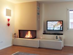 a living room with a fire place and television