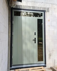 the front door to a house with wooden pallets