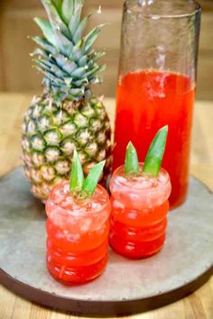 pineapple juice and two glasses of water on a tray