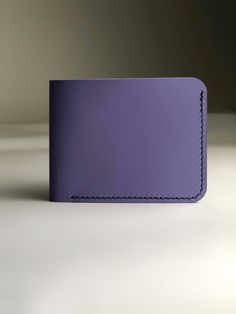 It is small blue wallet with 100% leather to serve you for a long time. It is small, lightweight, fits in your pocket. This is a wonderful personalized gift for your loved one. minimalist wallet women that combines elegance, classic and casual style. The custom wallet is made of genuine blue leather the wallet is stitched with red thread and made by hand with French stitching. The small personalized wallet make a beautiful gift for mother birthday gift, wife birthday gift, sister birthday gift. Wallet description: - Genuine leather - color blue-lavender - 4 card slots - 1 pockets for money - skin stretches to fit your lifestyle - painted and polished edges. - lavender thread, waxed - 100% handmade - Dimensions: Overall size: width 4.33 "- 11 cm height 3.5" - 9 cm Please note that due to th Sister Birthday Gift, Cute Wallet, Best Birthday Gift, Custom Wallet, Gift Sister, Birthday Gift For Mom, Anniversary Gift For Wife, Cute Wallets, Blue Wallet