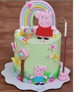 a peppa pig birthday cake on a table