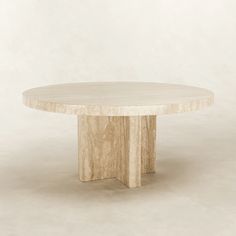 a round marble table on a plain white background with no one around it or someone else