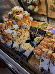 a display case filled with lots of sandwiches