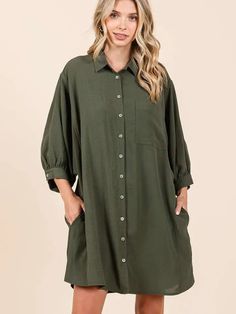 AIRFLOW WOVEN FABRIC - COLLARED - SINGLE CHEST POCKET - BUTTON DOWN FRONT - 3/4 LENGTH DOLMAN BALLOON SLEEVES WITH BUTTON CUFF - SIDE POCKETS - LOOSE FIT - MINI LENGTH - CURVED HEM Green Long Sleeve Shirt Dress With Button Closure, Oversized Long Sleeve Green Shirt Dress, Oversized Green Long Sleeve Shirt Dress, Casual Shirt Dress With 3/4 Roll-up Sleeves, Green Relaxed Fit Long Sleeve Shirt Dress, Green Long Sleeve Relaxed Fit Shirt Dress, Green Long Sleeve Shirt Dress With Pockets, Green Button-up Shirt Dress With Button Cuffs, Casual Dress With 3/4 Roll-up Sleeves