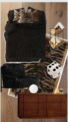 an overhead view of a living room with zebra print rugs and black couches