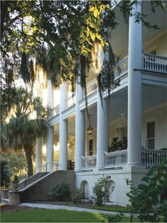 a large white house with columns and balconies