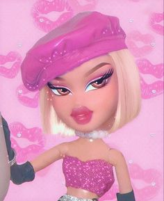 a barbie doll wearing a pink hat and dress with silver sequins on it