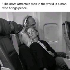 a man and woman sitting on an airplane with headphones in their ears while they look at each other